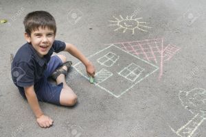 20673127-Child-drawing-sun-and-house-on-asphalt-in-a-park-Stock-Photo-children